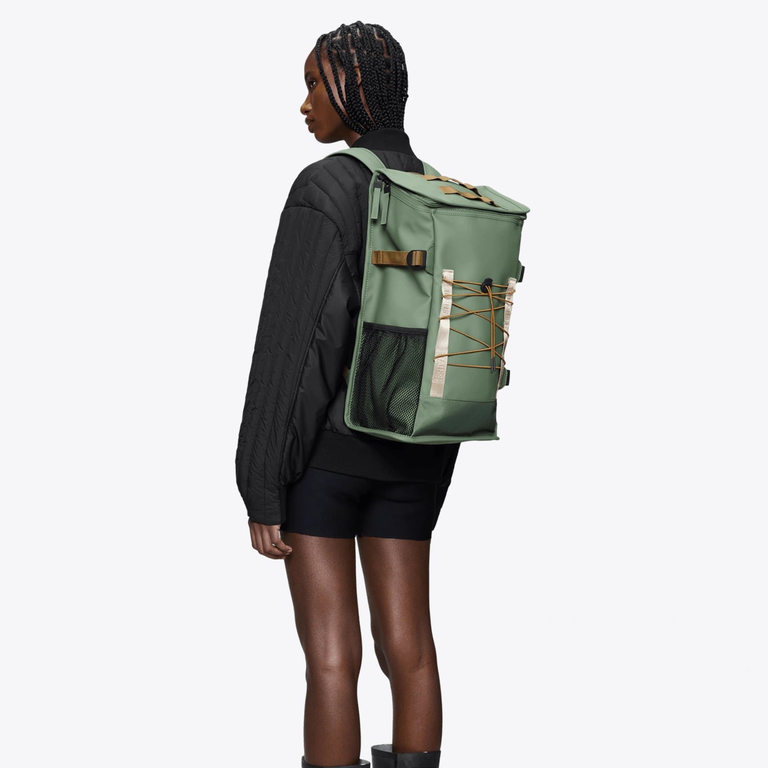 Trail Mountaineer Bag Well Backpack on a model showcasing its stylish design and adjustable straps.