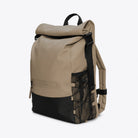 Trail Mountaineer Rolltop Beige Backpack showcased in a side view, featuring roll-top closure and padded straps.