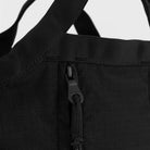 Close-up of the YKK zipper on the Grid Crossbody Bag Black Shoulder Bag showcasing its quality and durability.