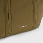 Grid Crossbody Bag Olive Shoulder Bag features durable ripstop fabric and sandqvist branding close-up.