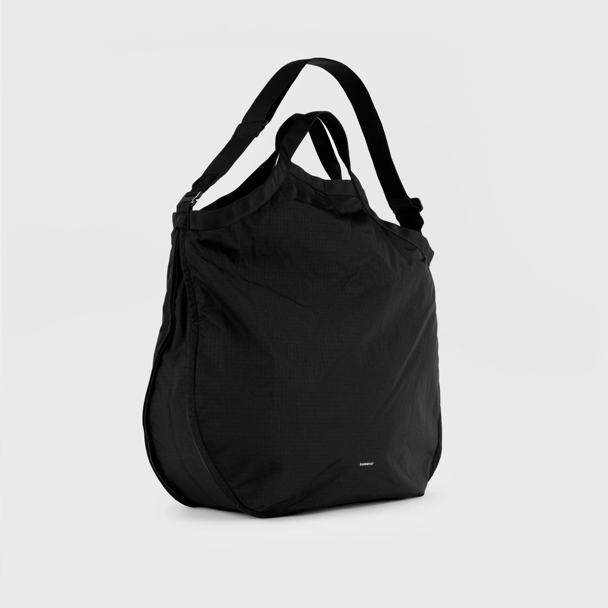 Grid Tote Bag Black Shoulder Bag, versatile and lightweight, showcasing its sleek design and adjustable straps.