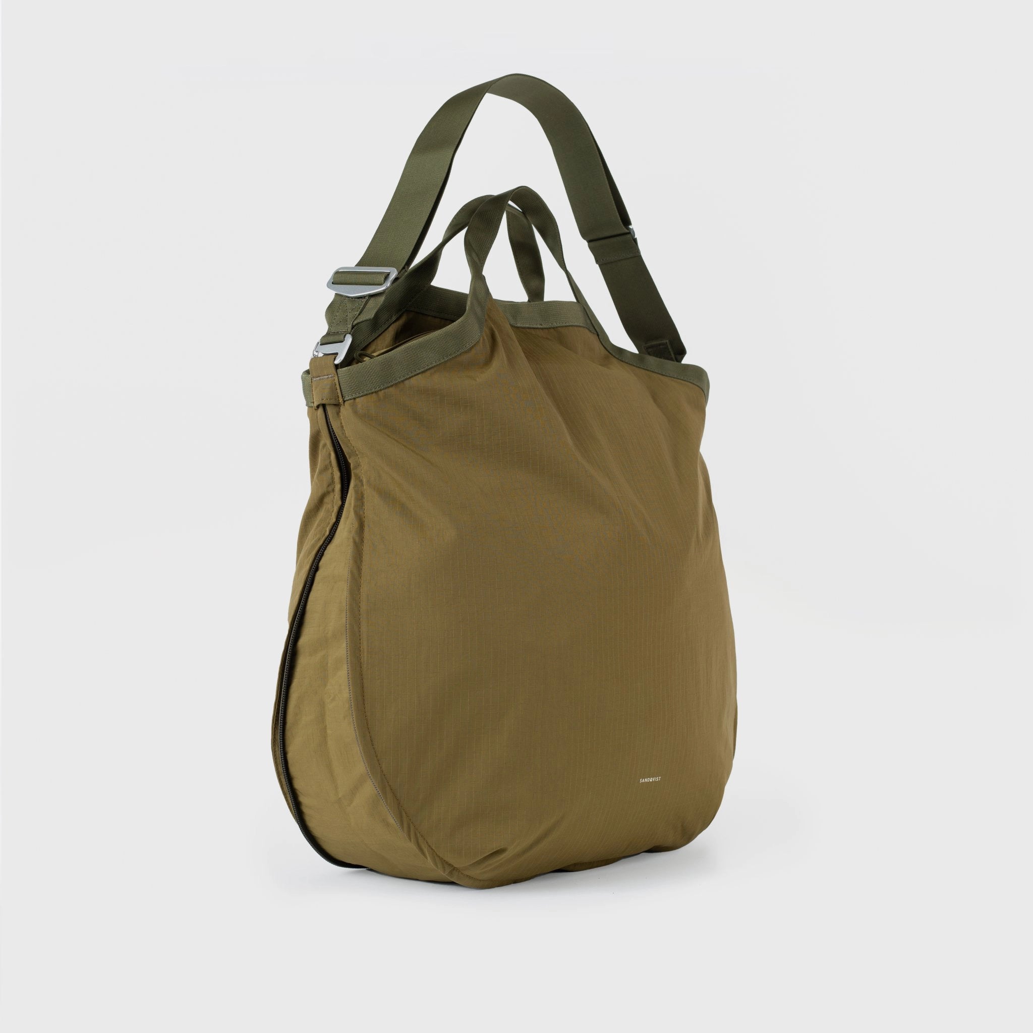 Grid Tote Bag Olive Shoulder Bag on a light background, showcasing its durable design and adjustable shoulder straps.