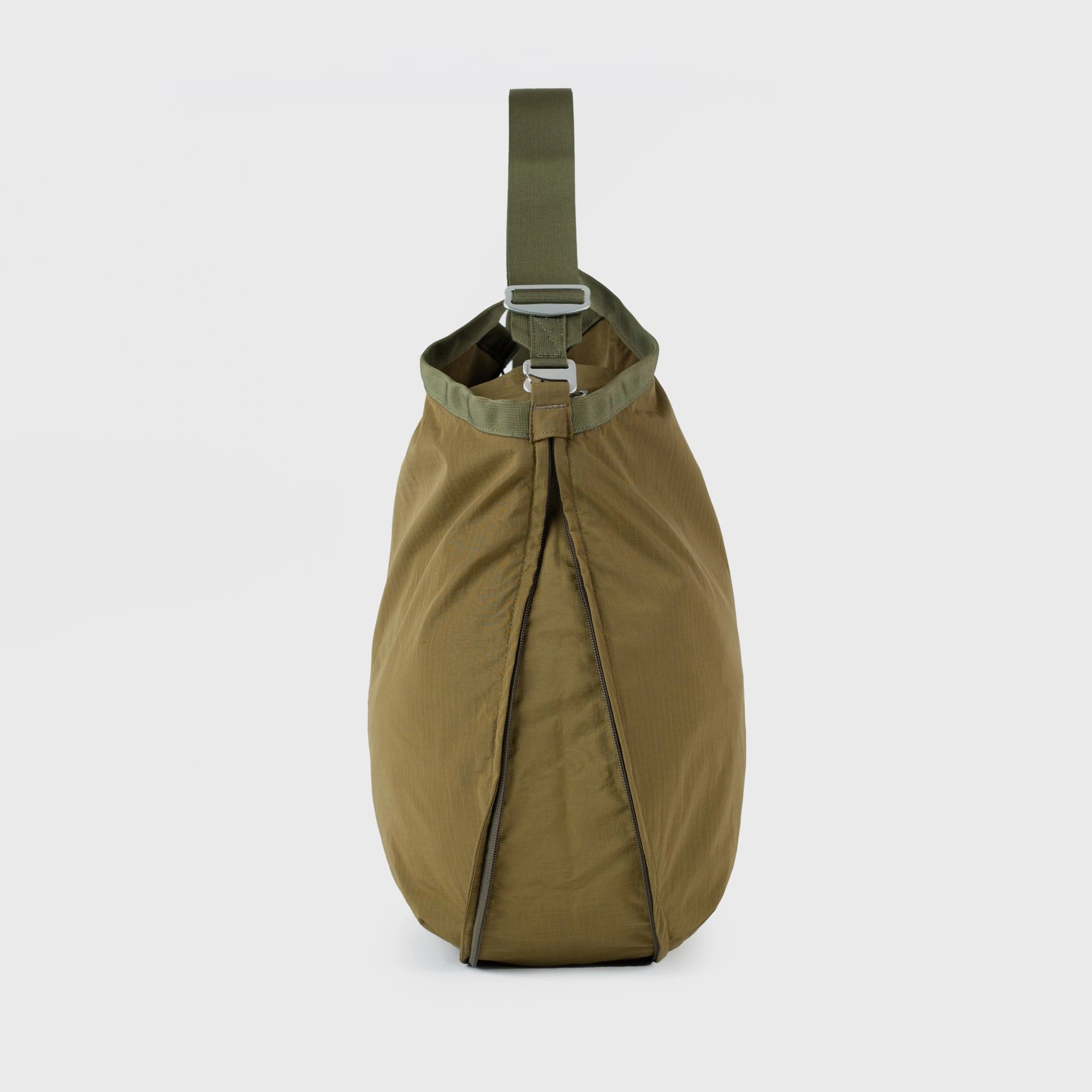 Grid Tote Bag Olive Shoulder Bag in olive color with adjustable strap, showcasing water-resistant material and zip closure.