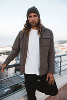 Model wearing Trip II Major Brown Overshirt with a beanie, showcasing its lightweight design and urban style.