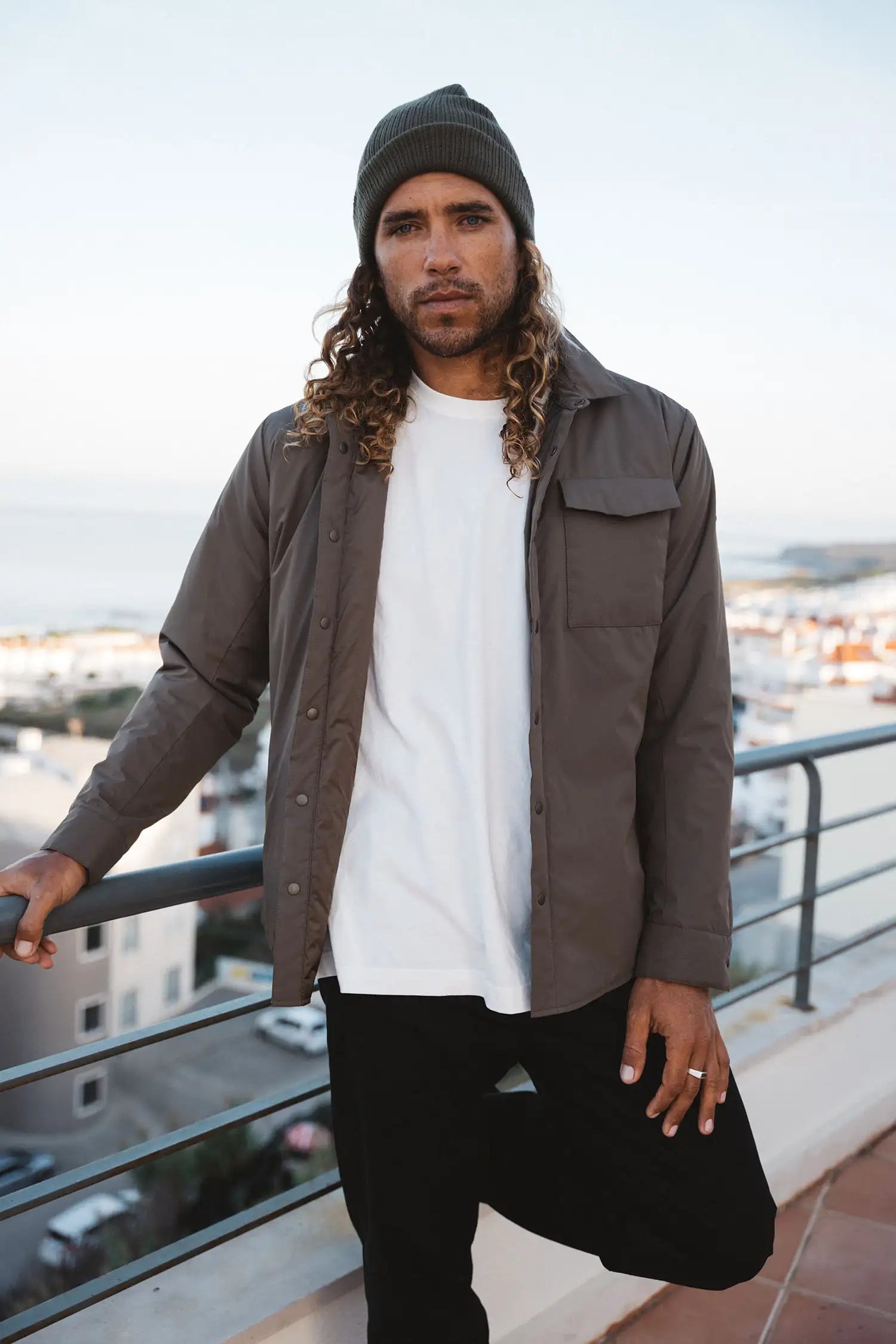 Model wearing Trip II Major Brown Overshirt with a beanie, showcasing its lightweight design and urban style.