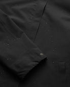 Flair II Short Onyx Jacket showing water droplets on windproof and waterproof fabric