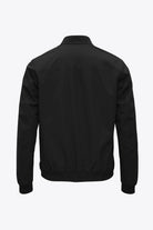 Back view of the Plain II Onyx Jacket, a versatile summer windproof and waterproof jacket.