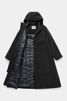 Mosebacke Long Matte Black Winter Coat showcasing a waterproof A-line silhouette with adjustable hood and two-way zipper.