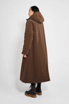 Mosebacke Long Matte Dark Brown Winter Coat shown from the back, featuring an adjustable hood and A-line silhouette.