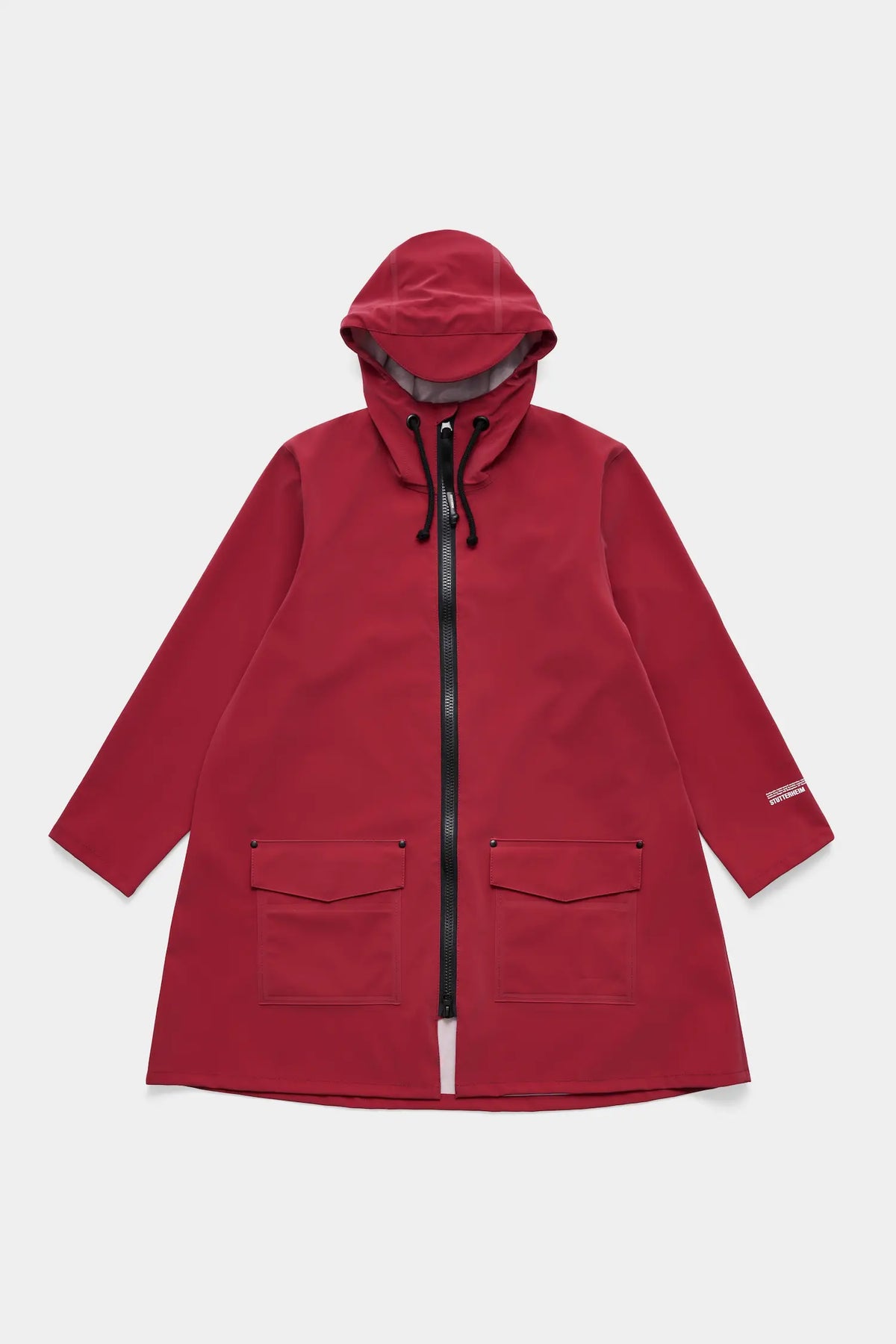 Mosebacke Patch Burgundy Raincoat with A-line silhouette and adjustable hood.