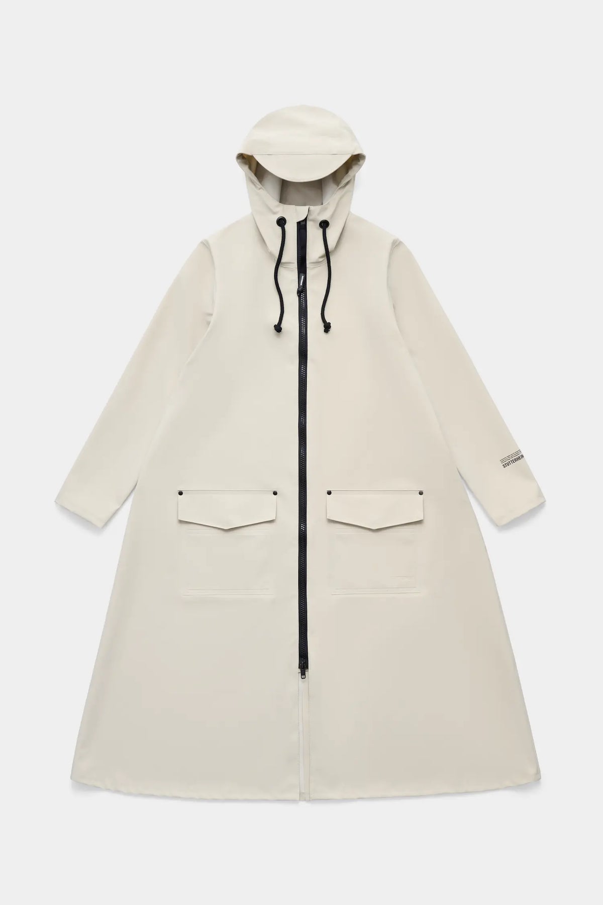 Mosebacke Long Patch Pelican Raincoat in beige with A-line silhouette and adjustable hood.