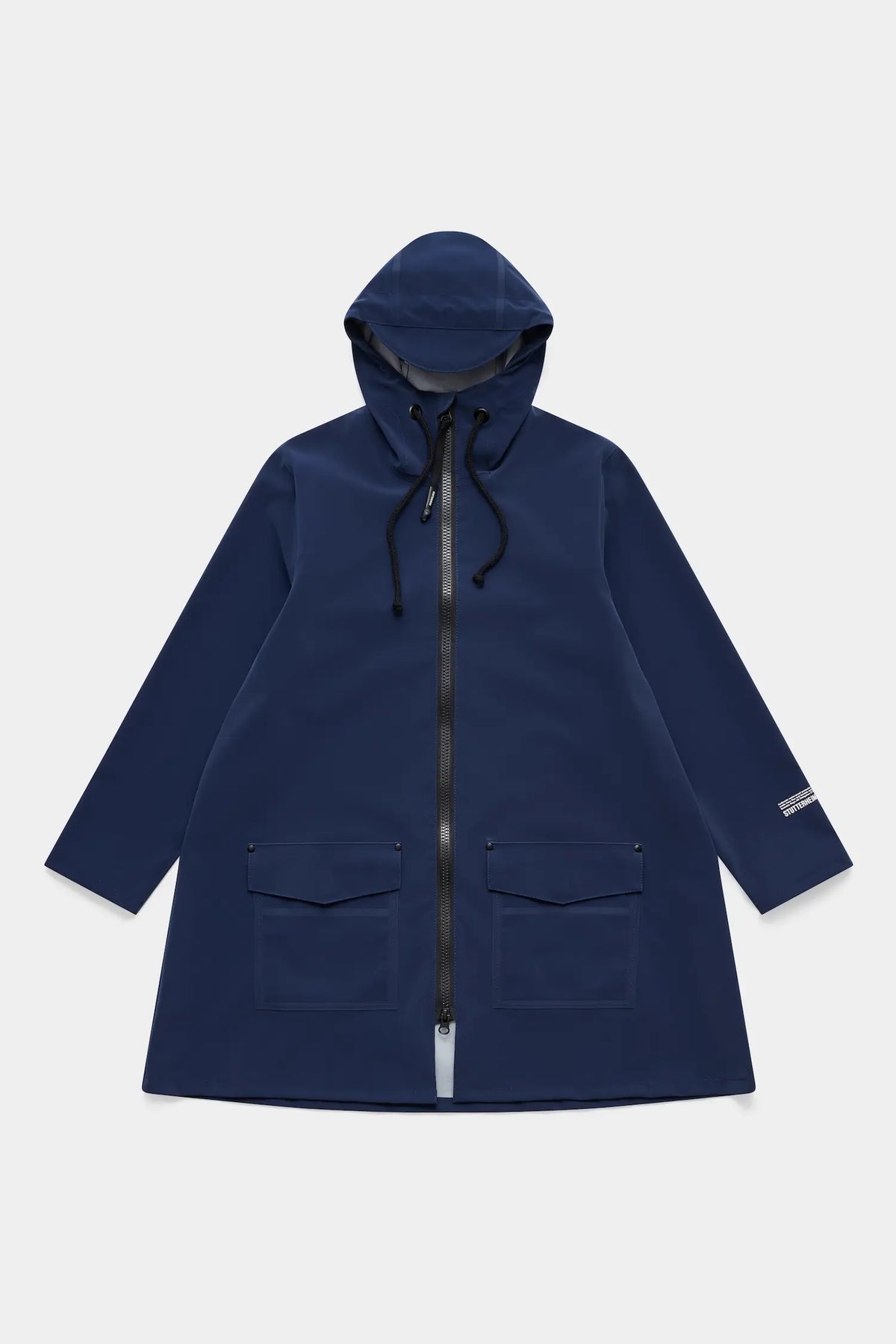 Mosebacke Patch Navy Raincoat featuring an A-line silhouette, adjustable hood, and patch pockets.
