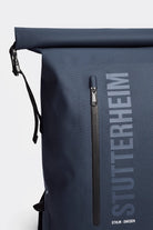 Rain Rolltop 25L Navy Backpack featuring a rolltop closure and waterproof zippers.