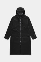 Stockholm Long Patch Black Raincoat featuring adjustable drawstring hood and patch pockets.