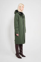 Stockholm Long Matte Green Winter Coat displayed on a model, showcasing its sleek design and adjustable hood.