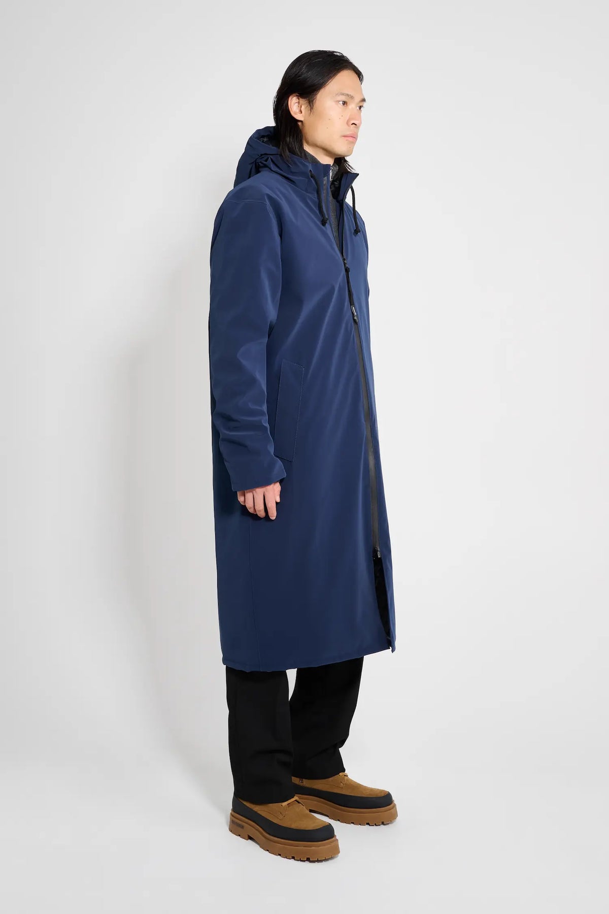 Stockholm Long Matte Navy Winter Coat displayed on a model, showcasing its waterproof and breathable features.