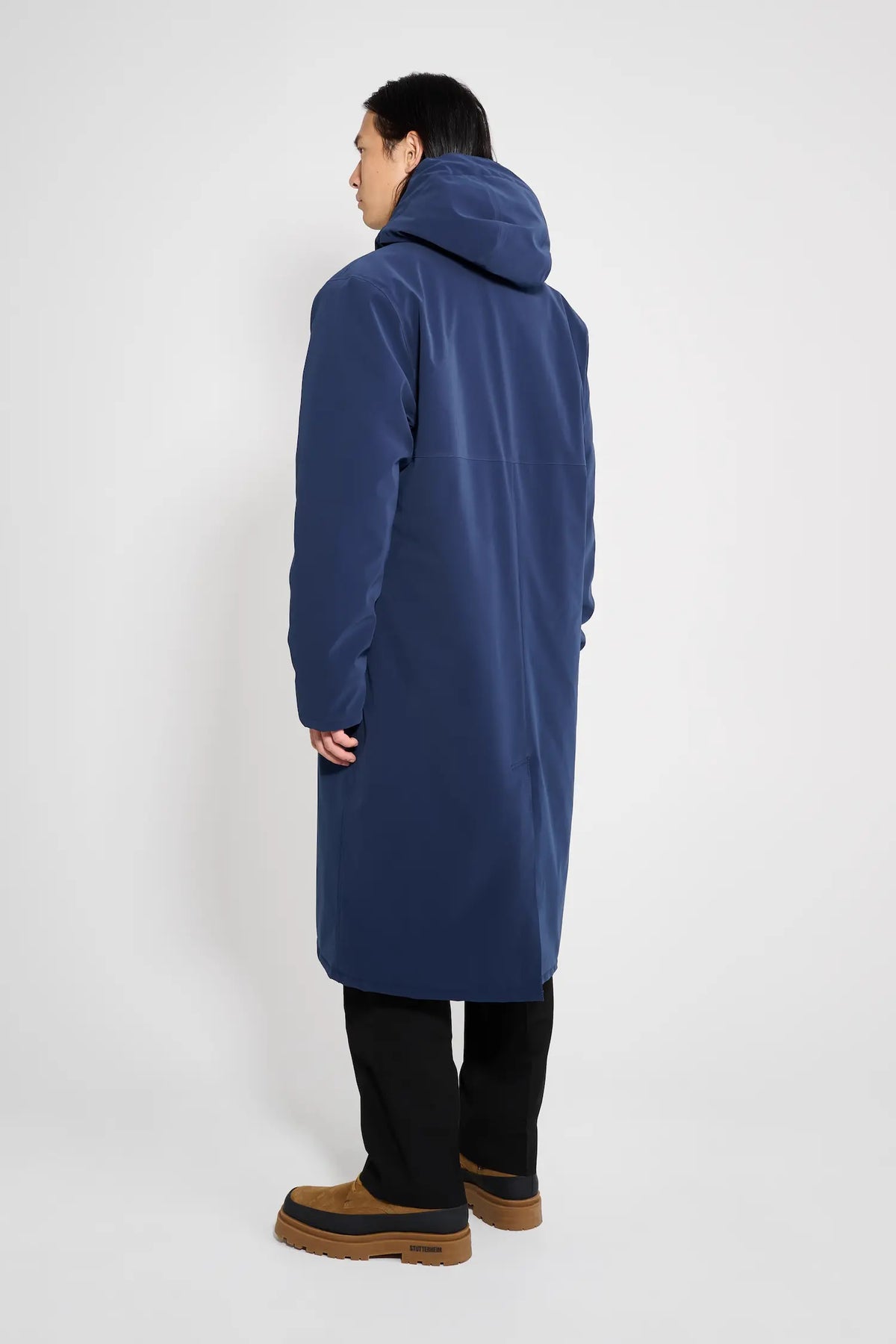 Stockholm Long Matte Navy Winter Coat displayed from the back, showcasing the adjustable hood and waterproof design.