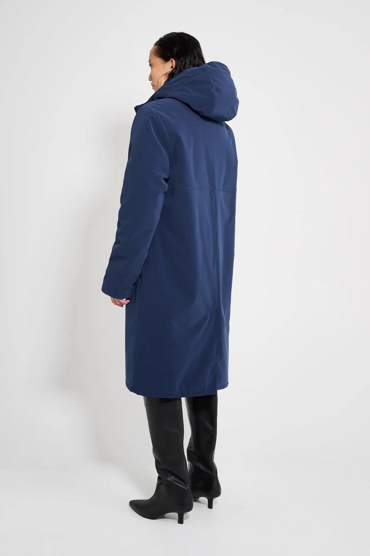 Back view of Stockholm Long Matte Navy Winter Coat showcasing the adjustable hood and oversized fit.