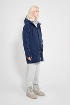 Stockholm Patch Navy Raincoat worn by model, showcasing its oversized fit and waterproof features.