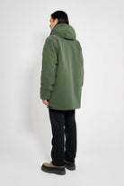 Stockholm Matte Green Winter Coat shown from behind, featuring an adjustable hood and waterproof design.