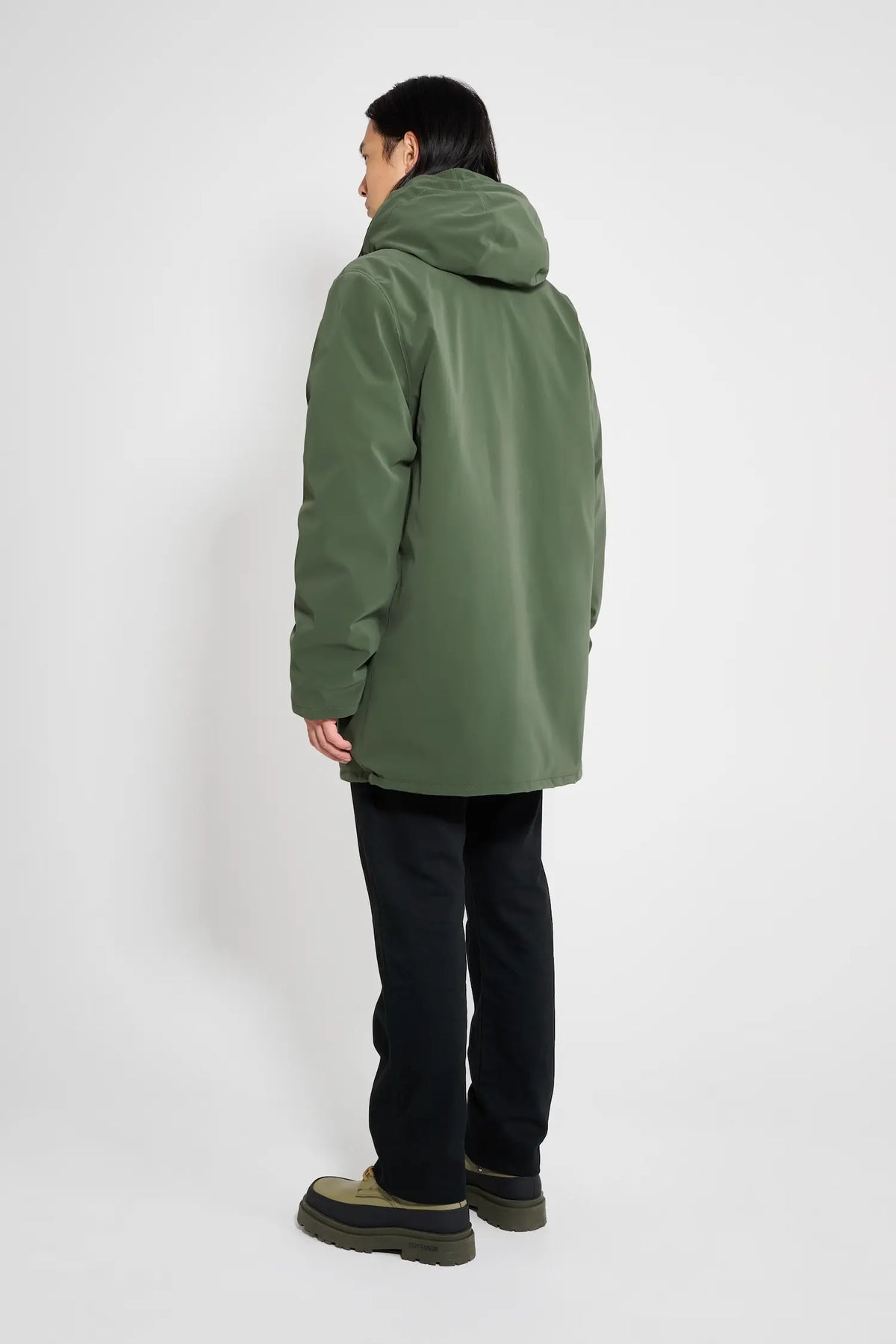 Stockholm Matte Green Winter Coat shown from behind, featuring an adjustable hood and waterproof design.