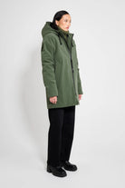 Stockholm Matte Green Winter Coat on model showcasing oversized fit and adjustable drawstring hood.