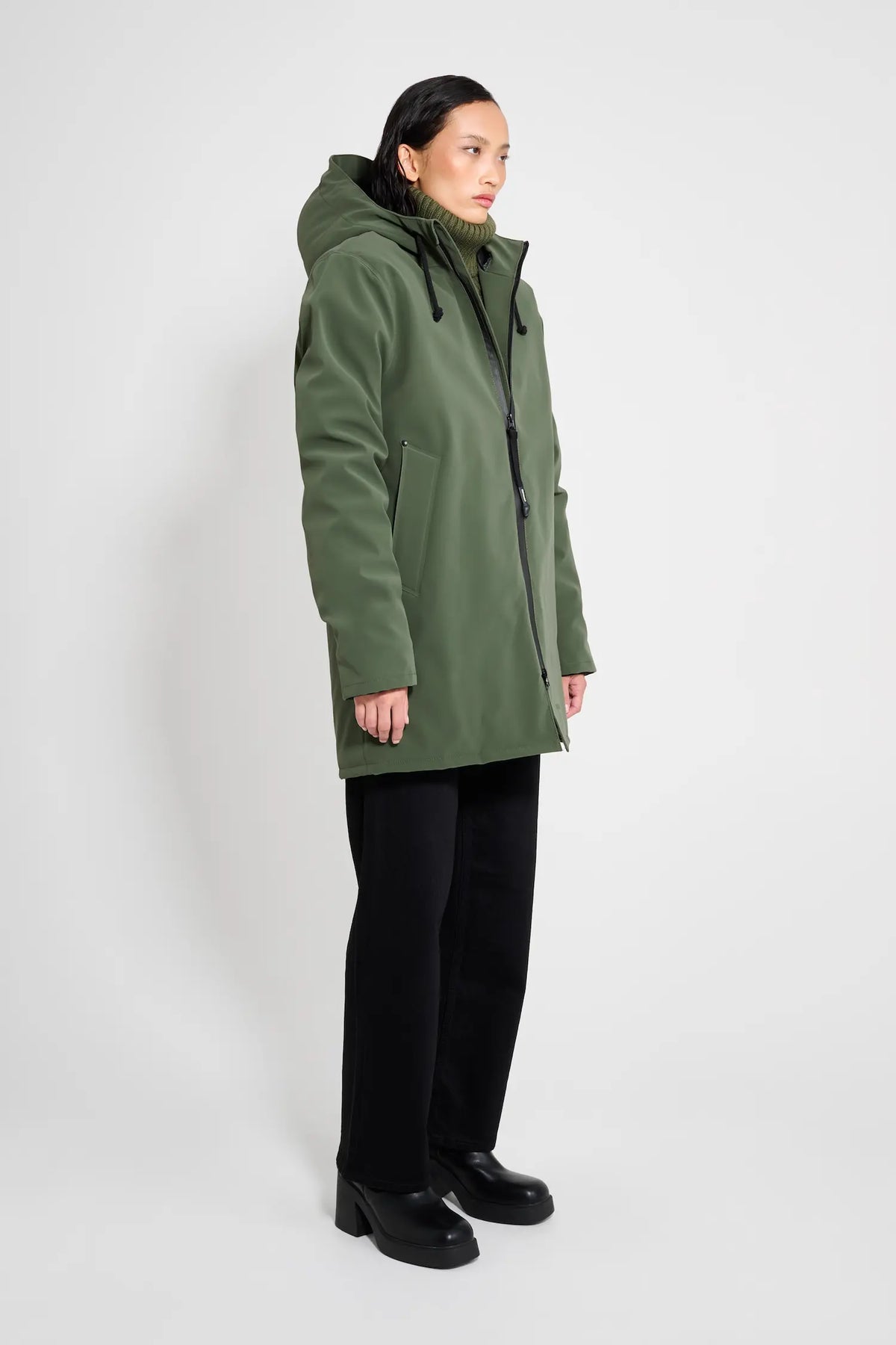 Stockholm Matte Green Winter Coat on model showcasing oversized fit and adjustable drawstring hood.