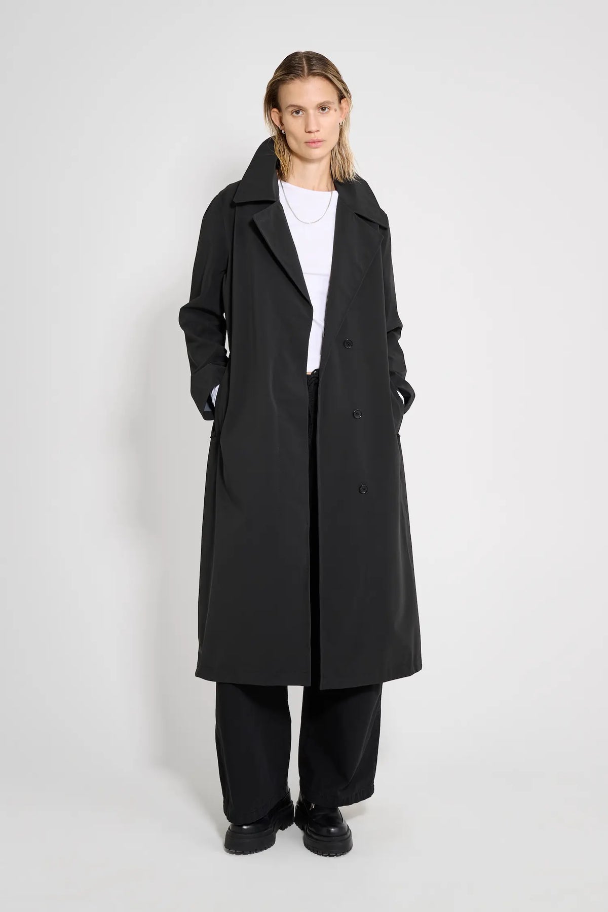 Wayfair Black Trench Coat displayed on model with oversized fit and hidden button closure.
