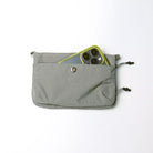 Phone Sacoche 90 Purple Washed Silk Nylon Bag with phone in quick access pocket.