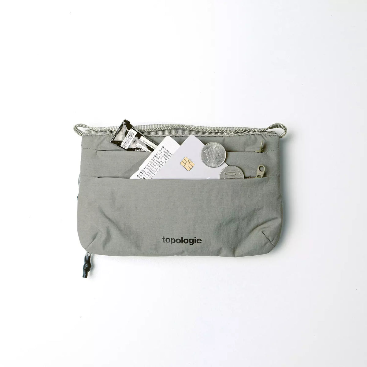 Phone Sacoche 90 Chambray Silky Peach Bag in grey with cards and coins visible.