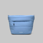 Besace Chambray Silky Peach Bag in light blue, lightweight sling bag with a zipper closure and compartments.