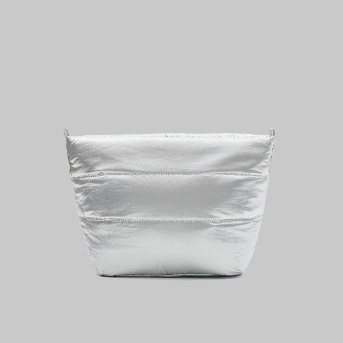 Besace Chrome Space Coated Bag in lightweight, shiny silver material with structured body.