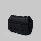 Bottle Sacoche Large Black Silky Peach Bag in black, showing its stylish padded design and compartments.