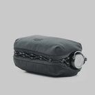 Bottle Sacoche Large Burnt Ash Papery Bag in sleek gray fabric with secured bottle compartment.