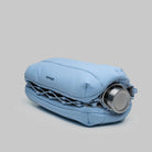 Bottle Sacoche Large Chambray Silky Peach Bag showcasing a water repellent design and bottle compartment.