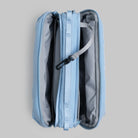 Bottle Sacoche Large Chambray Silky Peach Bag opened showing compartments and internal organizer pockets.