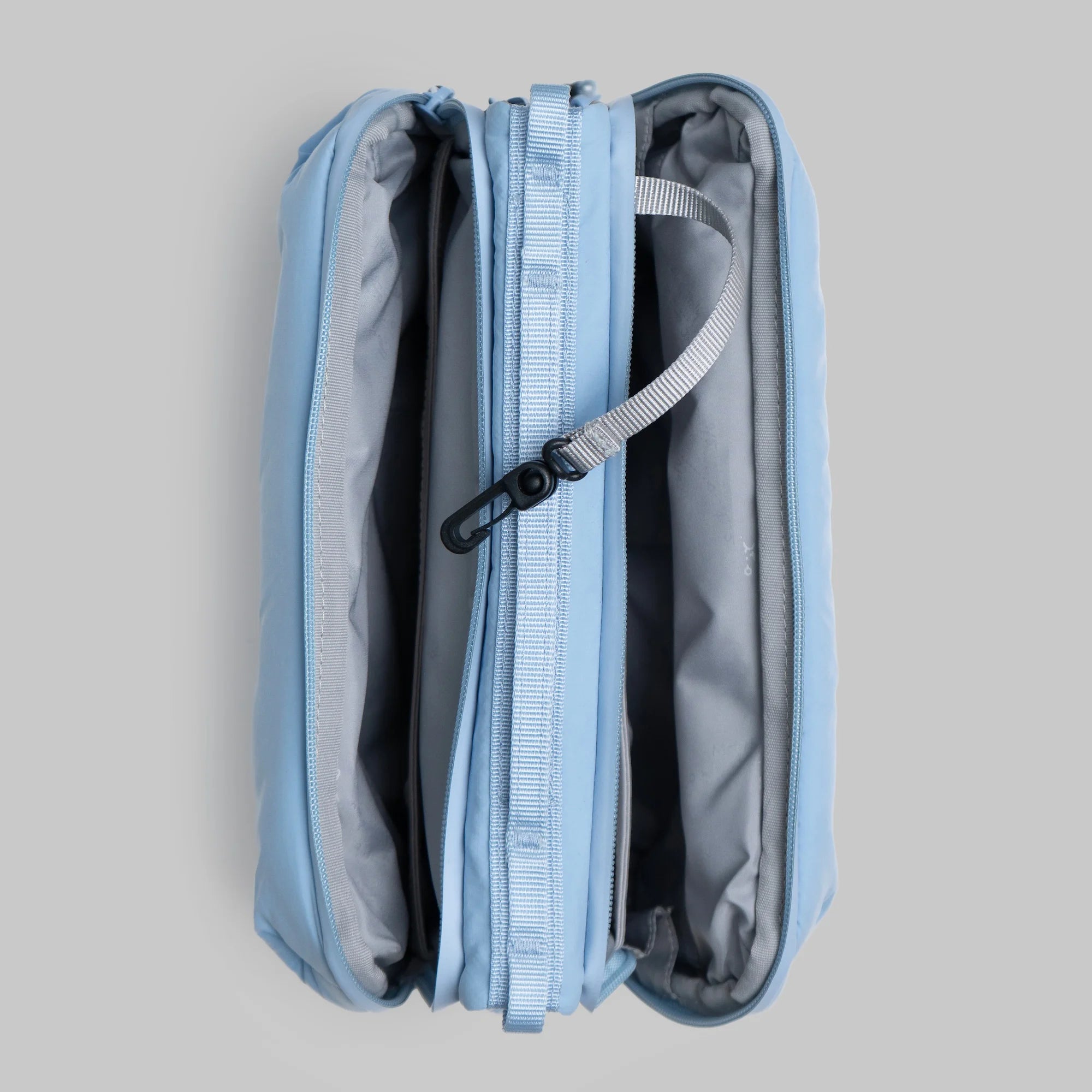 Bottle Sacoche Large Chambray Silky Peach Bag opened showing compartments and internal organizer pockets.