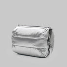 Bottle Sacoche Large Chrome Space Coated Bag in shiny silver color, featuring water repellent fabric and zipped compartments.