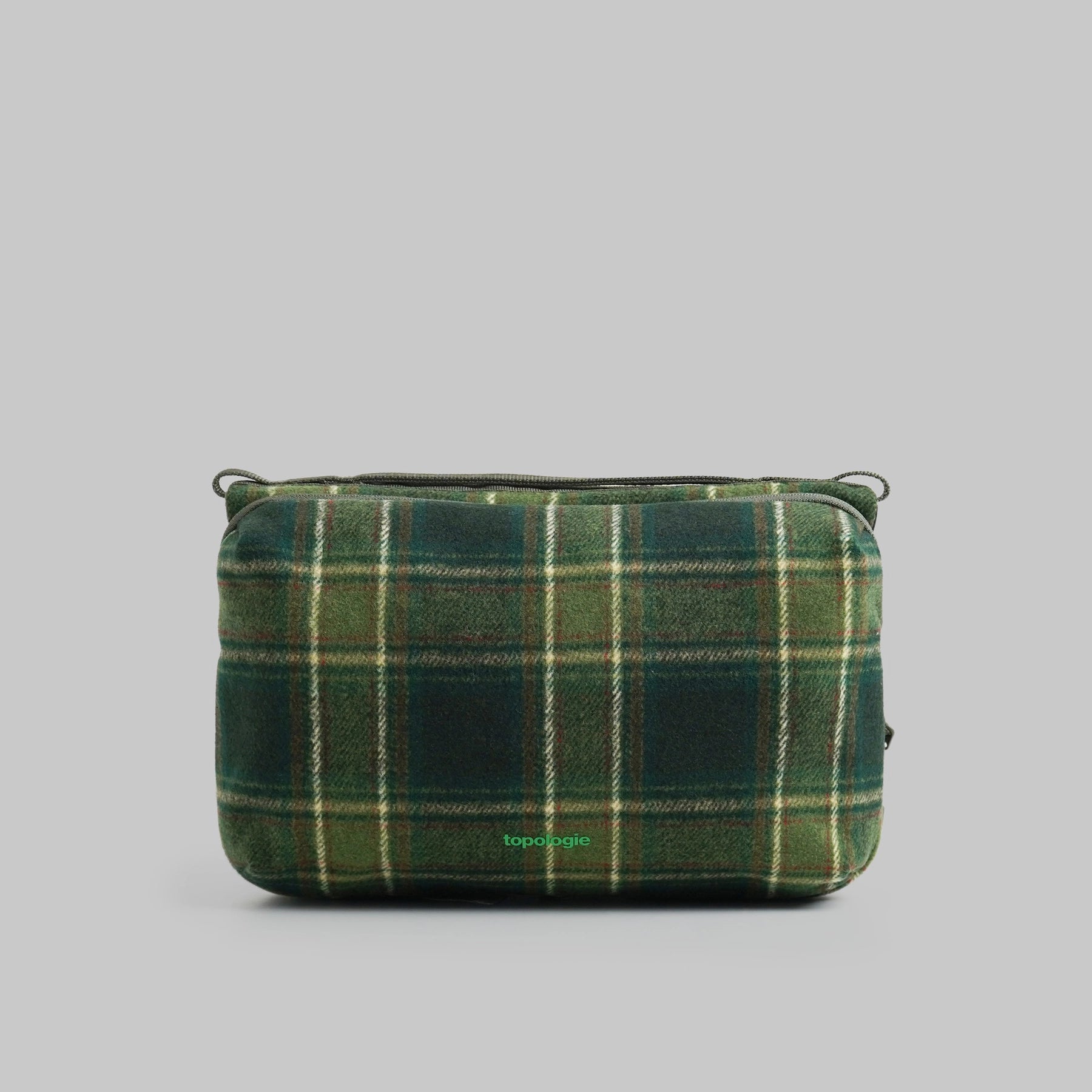 Bottle Sacoche Large Green Check Wool Bag in green check pattern with zipper compartments.