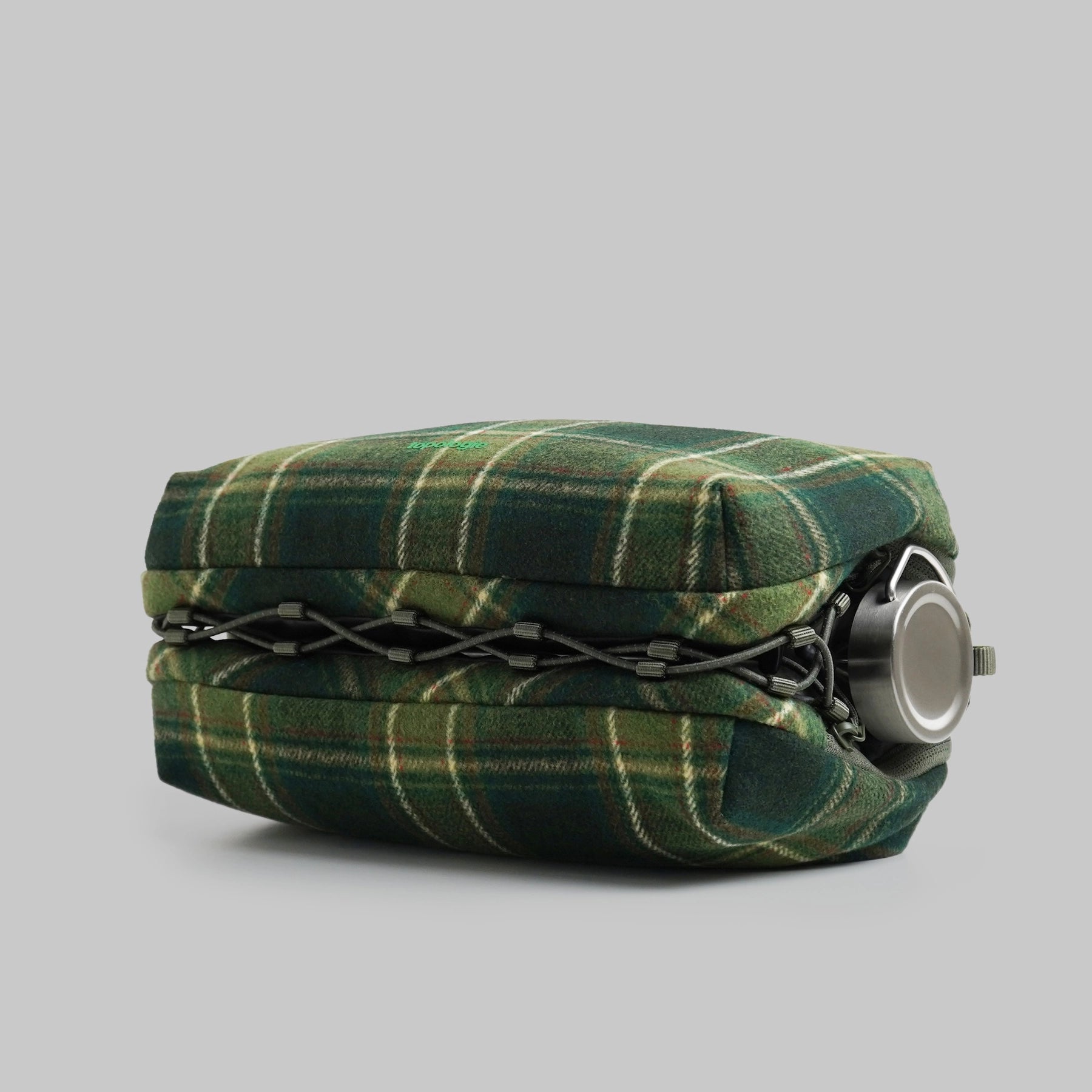 Bottle Sacoche Large Green Check Wool Bag side view showcasing the water repellent fabric and elastic cord.