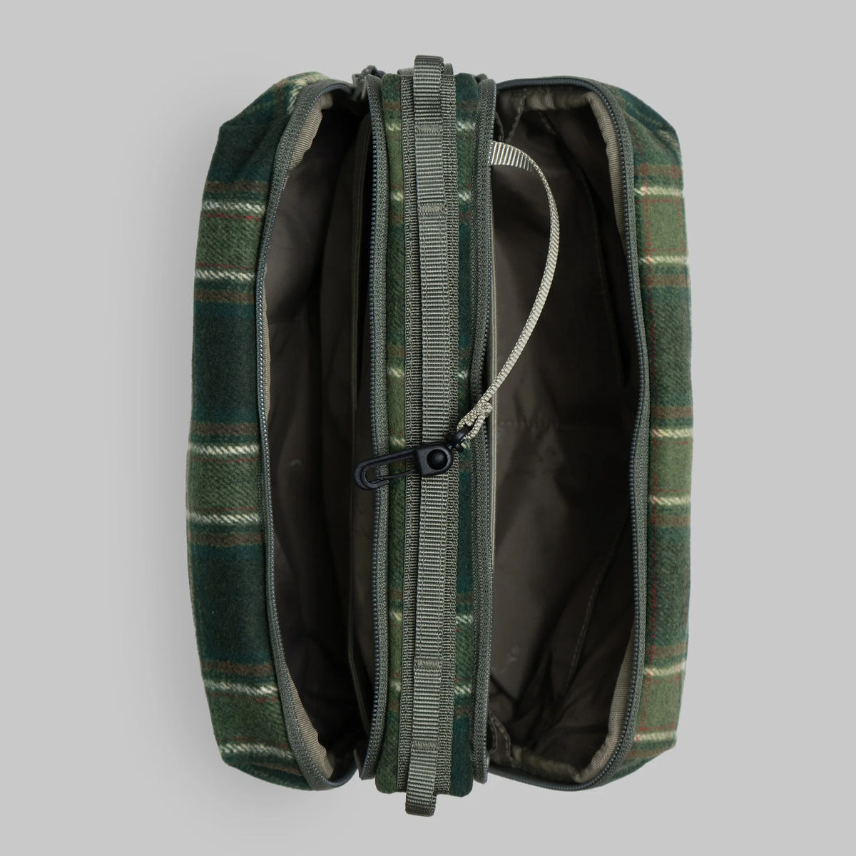 Bottle Sacoche Large Green Check Wool Bag showing internal compartments and zippers.
