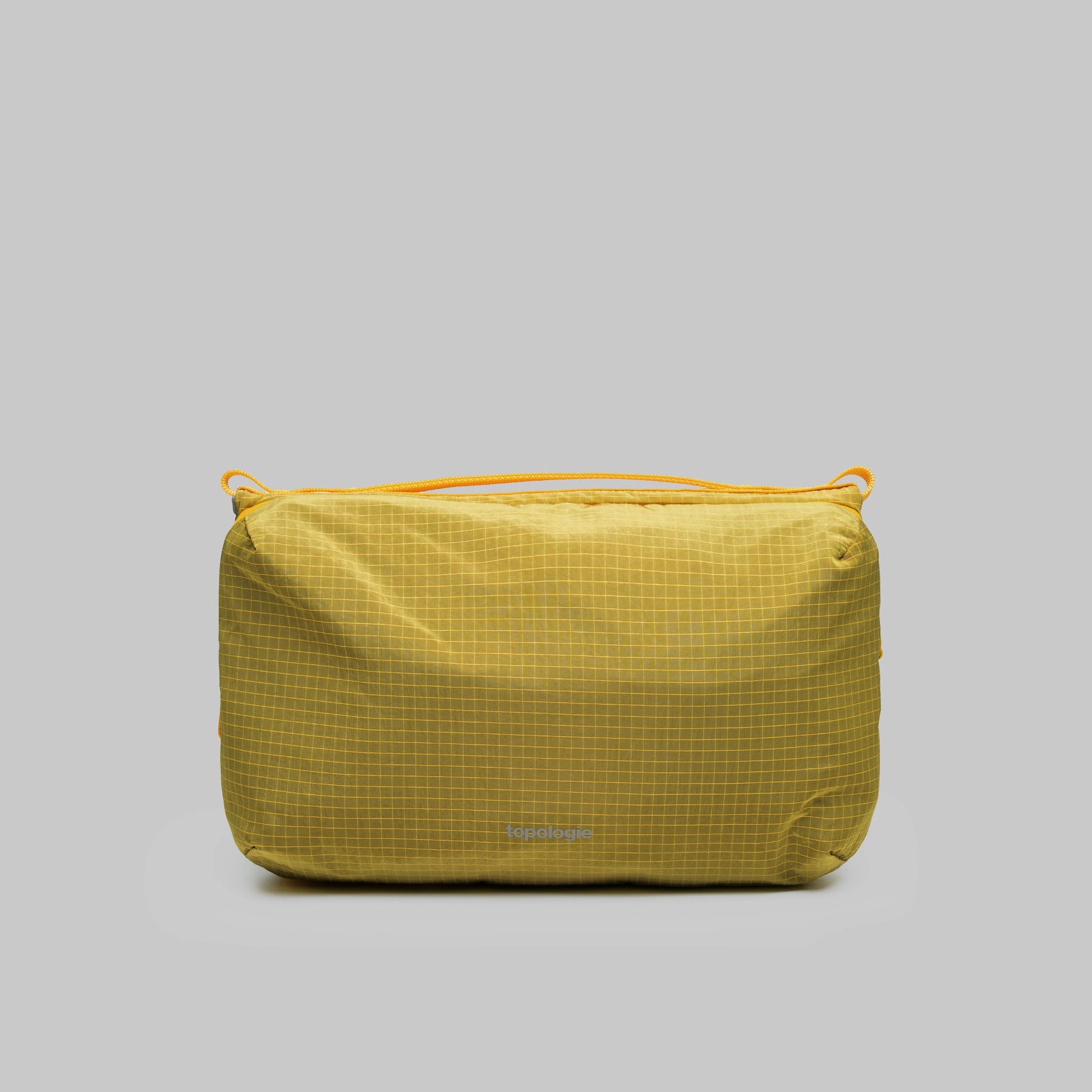 Bottle Sacoche Large Mustard Vintage Ripstop Bag in yellow grid pattern, showcasing water repellent fabric and zippers.