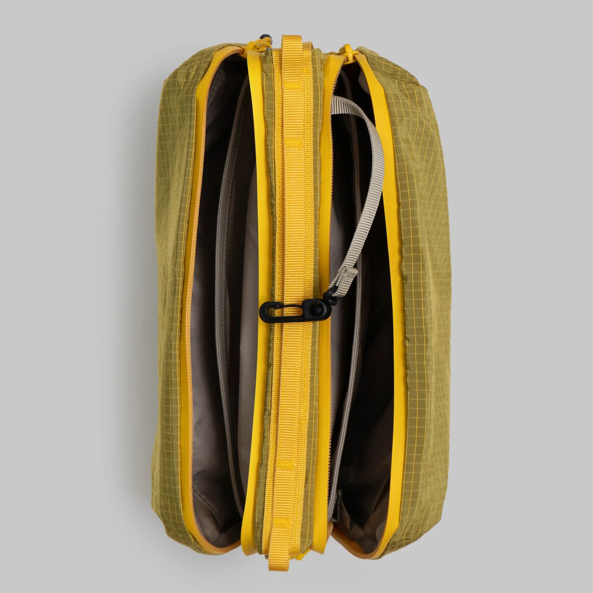 Bottle Sacoche Large Mustard Vintage Ripstop Bag with open zippers revealing compartments and organizers.