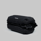 Bottle Sacoche Medium Black Silky Peach Bag in black water repellent fabric, compact design with external cord.