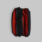 Bottle Sacoche Medium Black Silky Peach Bag showing internal compartments in black and red design.