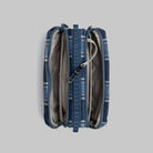 Top view of Bottle Sacoche Medium Blue Check Wool Bag showcasing zipped compartments and internal organizers.