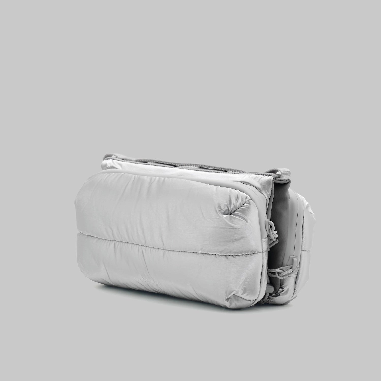 Bottle Sacoche Medium Chrome Space Coated Bag showcasing its sleek, water repellent design.