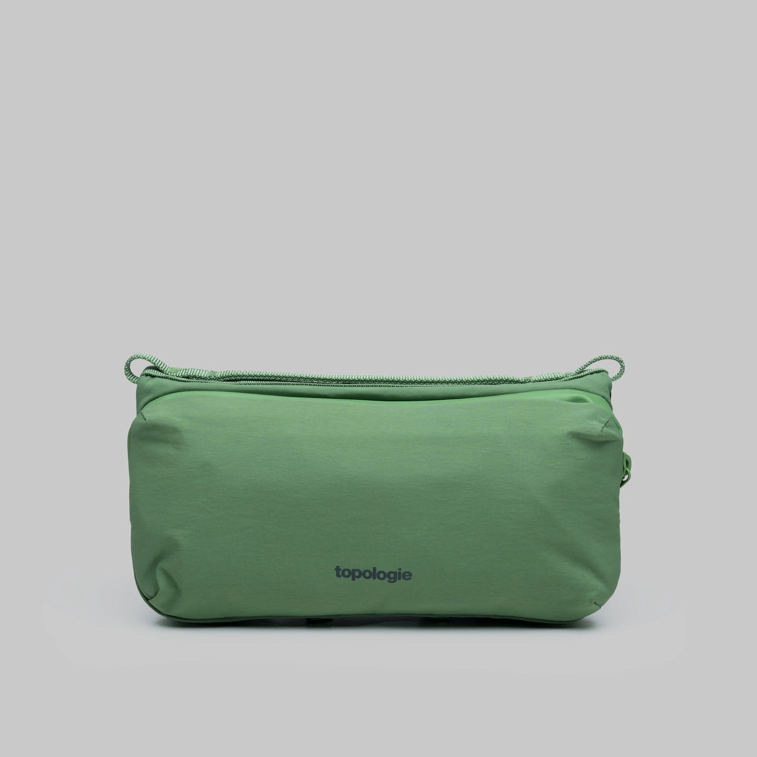 Bottle Sacoche Medium Ivy Green Papery Bag with two main zipped compartments and key hook.