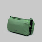 Bottle Sacoche Medium Ivy Green Papery Bag showcasing a water repellent fabric and zippers.