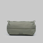 Bottle Sacoche Medium Moss Silky Peach Bag in water repellent recycled nylon, featuring zipped compartments.